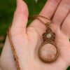fossilized coral prehnite macrame necklace hand 1